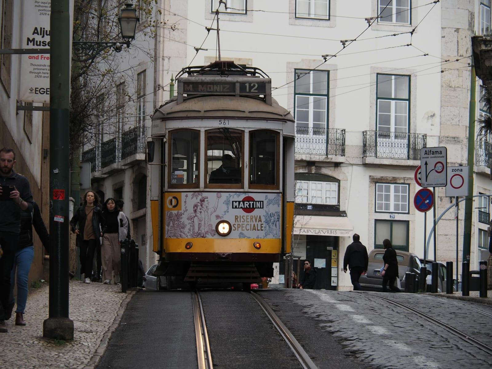 Ride a Lisbon tram up to Alfama, Portugal